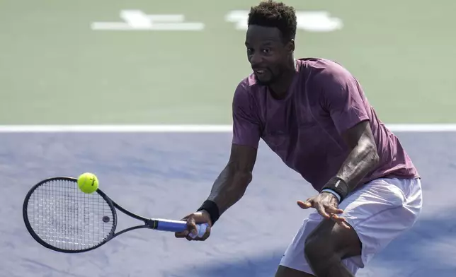 Gael Monfils of France plays a forehand return against his compatriot Ugo Humbert during the men's singles third round match in the Shanghai Masters tennis tournament at Qizhong Forest Sports City Tennis Center in Shanghai, China (AP Photo/Andy Wong)