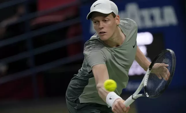 Jannik Sinner of Italy plays a backhand return against Machac of the Czech Republic during the men's singles semifinals match in the Shanghai Masters tennis tournament at Qizhong Forest Sports City Tennis Center in Shanghai, China, Saturday, Oct. 12, 2024. (AP Photo/Andy Wong)