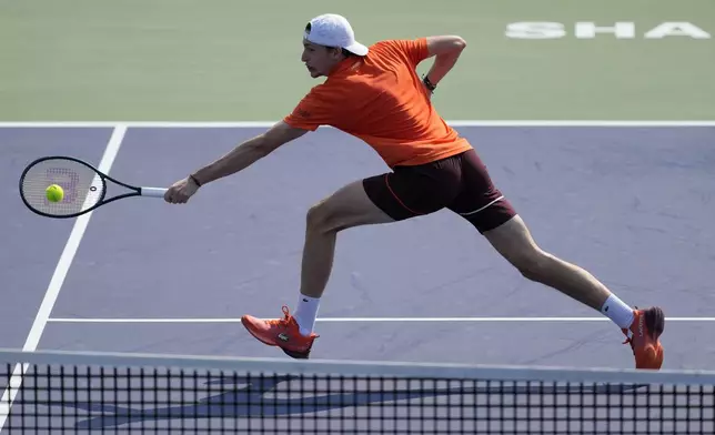 Ugo Humbert of France plays a backhand return against his compatriot Gael Monfils during the men's singles third round match in the Shanghai Masters tennis tournament at Qizhong Forest Sports City Tennis Center in Shanghai, China (AP Photo/Andy Wong)