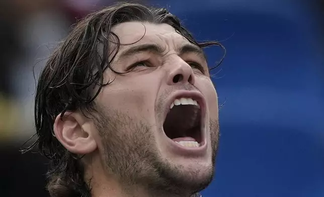 Taylor Fritz of the United States celebrates after defeating David Goffin of Belgium in the men's singles quarterfinals match of the Shanghai Masters tennis tournament at Qizhong Forest Sports City Tennis Center in Shanghai, China, Friday, Oct. 11, 2024. (AP Photo/Andy Wong)