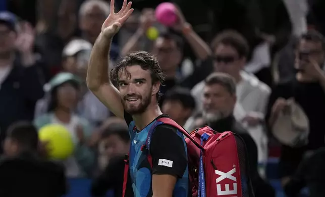 Tomas Machac of the Czech Republic waves to the spectators as he leaves the court after defeated by Jannik Sinner of Italy in their men's singles semifinals match of the Shanghai Masters tennis tournament at Qizhong Forest Sports City Tennis Center in Shanghai, China, Saturday, Oct. 12, 2024. (AP Photo/Andy Wong)