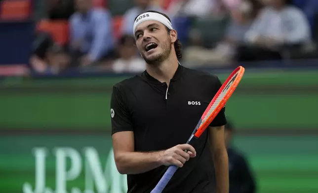 Taylor Fritz of the United States reacts during the men's singles quarterfinals match against David Goffin of Belgium in the Shanghai Masters tennis tournament at Qizhong Forest Sports City Tennis Center in Shanghai, China, Friday, Oct. 11, 2024. (AP Photo/Andy Wong)