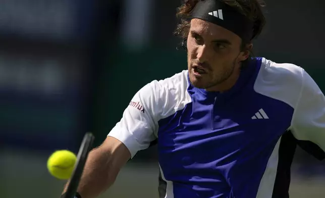 Stefanos Tsitsipas of Greece plays a backhand return against Alexandre Muller of France during the men's singles third round match in the Shanghai Masters tennis tournament at Qizhong Forest Sports City Tennis Center in Shanghai, China (AP Photo/Andy Wong)