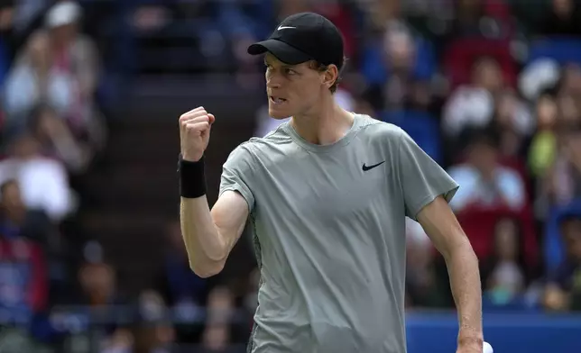 Jannik Sinner of Italy reacts during the men's singles fourth round match against Ben Shelton of the United States, in the Shanghai Masters tennis tournament at Qizhong Forest Sports City Tennis Center in Shanghai, China, Wednesday, Oct. 9, 2024. (AP Photo/Andy Wong)