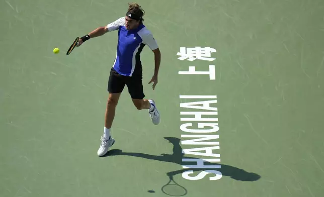 Stefanos Tsitsipas of Greece plays a backhand return against Alexandre Muller of France during the men's singles third round match in the Shanghai Masters tennis tournament at Qizhong Forest Sports City Tennis Center in Shanghai, China (AP Photo/Andy Wong)