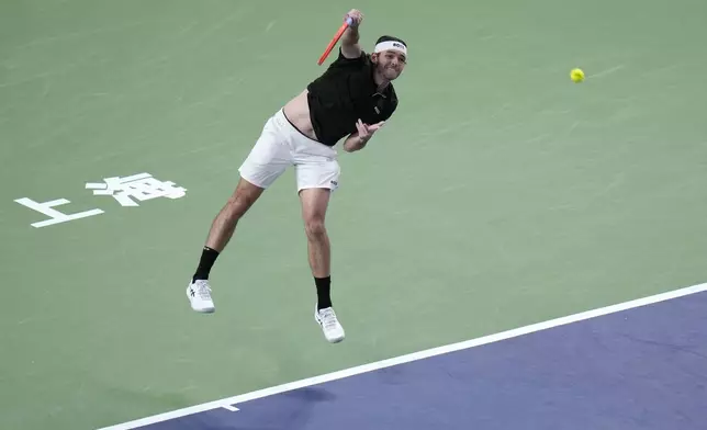 Taylor Fritz of the United States serves against Terence Atmane of France during the men's singles second round match in the Shanghai Masters tennis tournament at Qizhong Forest Sports City Tennis Center in Shanghai, China, Monday, Oct. 7, 2024. (AP Photo/Andy Wong)