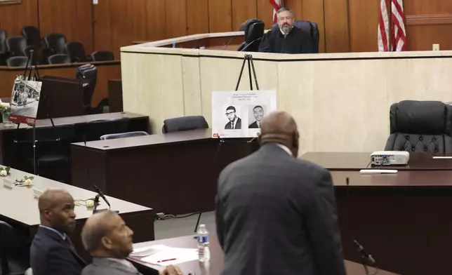 Charles Barr, foreground, speaks to Judge Robert Hood during a hearing where Barr's record was cleared after he was arrested in 1960 for sitting at an all-white South Carolina lunch counter on Friday, Oct. 25, 2024, in Columbia, S.C. (AP Photo/Jeffrey Collins)