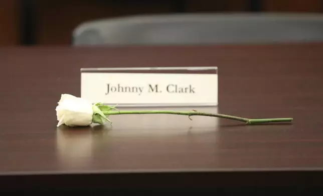 A white rose and a nameplace honor one of five men who died before their records could be cleared after they were arrested in 1960 for sitting at an all-white South Carolina lunch counter on Friday, Oct. 25, 2024, in Columbia, S.C. (AP Photo/Jeffrey Collins)