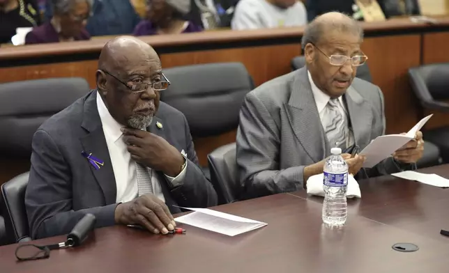 Charles Barr, left, and Simon Bouie, right, wait for a hearing to start where their records were cleared after they were arrested in 1960 for sitting at an all-white South Carolina lunch counter on Friday, Oct. 25, 2024, in Columbia, S.C. (AP Photo/Jeffrey Collins)