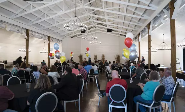 Community members mingle at the opening of the Shawnee Language Center on Friday, September 20, 2024 in Miami, Okla.. (AP Photo/Nick Oxford)