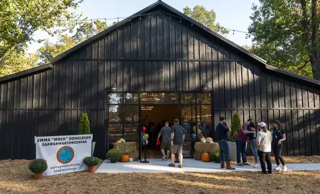 Community members enter the Shawnee Language Center on Friday, September 20, 2024 in Miami, Okla.. (AP Photo/Nick Oxford)