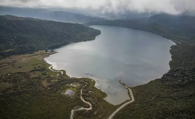 FILE - Clouds float over the Chingaza lagoon in the paramo of Chingaza National Natural Park, Colombia, March 19, 2024, the primary water source for millions of residents in the capital city of Bogota. (AP Photo/Ivan Valencia, File)