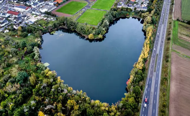 FILE - A lake in the shape of a heart is visible in Rodgau, near Frankfurt, Germany, Saturday, Oct. 12, 2024. (AP Photo/Michael Probst, File)