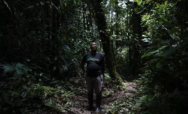 Melqui Mosquera, a teacher, poses in El Guayacan nature reserve in San Isidro, Colombia, Tuesday, Sept. 24, 2024. (AP Photo/Ivan Valencia)