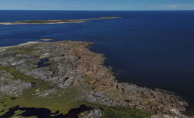 The Churchill River, left, empties into the Hudson Bay, right, Thursday, Aug. 8, 2024, near Churchill, Manitoba. (AP Photo/Joshua A. Bickel)