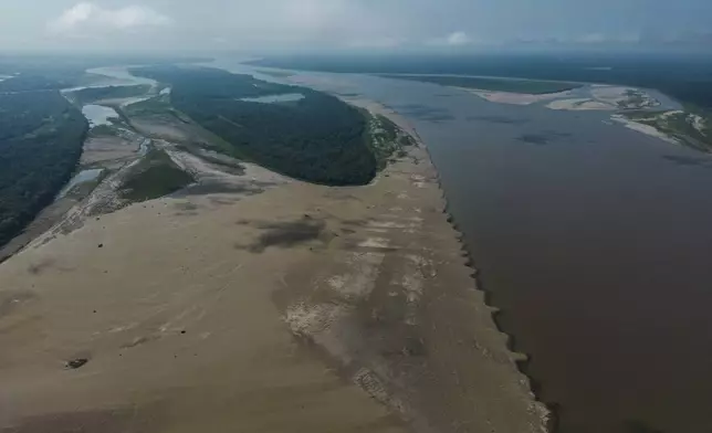 Signs of drought are visible on the Amazon River, near Leticia, Colombia, Sunday, Oct. 20, 2024. (AP Photo/Ivan Valencia)