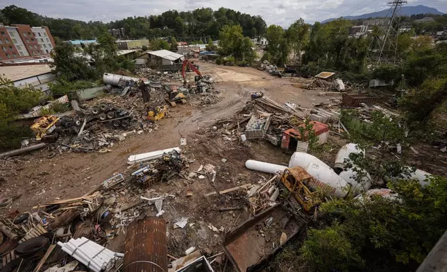 FILE - Debris is visible in the aftermath of Hurricane Helene, Sept. 30, 2024, in Asheville, N.C. (AP Photo/Mike Stewart, File)