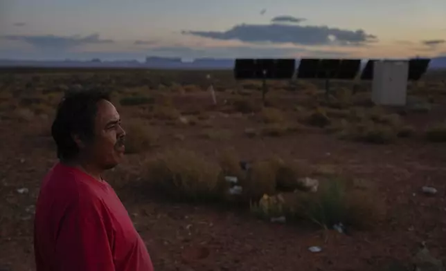 Ricky Gillis looks at the sunset, Tuesday, Oct. 8, 2024, at his home on the Navajo Nation in Halchita, Utah. (AP Photo/Joshua A. Bickel)