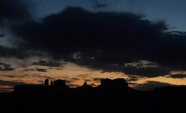 The sun sets, Tuesday, Oct. 8, 2024, near Monument Valley on the Navajo Nation in Halchita, Utah. (AP Photo/Joshua A. Bickel)