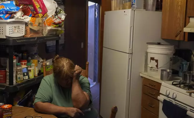 Lorraine Black sits inside her kitchen, Wednesday, Oct. 9, 2024, on the Navajo Nation in Halchita, Utah. (AP Photo/Joshua A. Bickel)