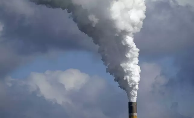 The Schkopau coal-fired power plant operates in Teutschenthal, near Halle, eastern Germany, Tuesday, Oct. 15, 2024. (AP Photo/Matthias Schrader)