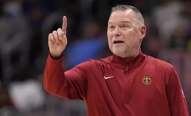 Denver Nuggets head coach Michael Malone reacts during the first half of an NBA basketball game against the Los Angeles Clippers, Saturday, Oct. 26, 2024, in Denver. (AP Photo/Jack Dempsey)