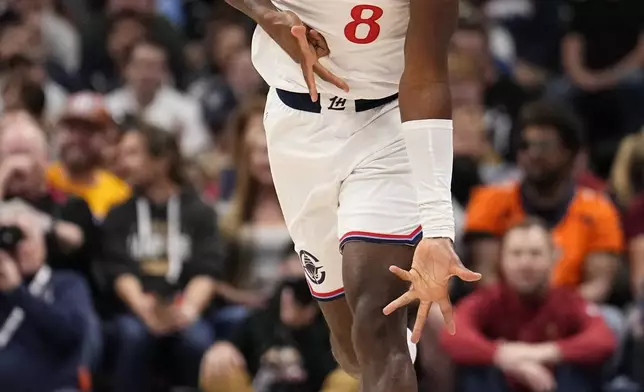 Los Angeles Clippers guard Kris Dunn celebrates a three-point basket against the Denver Nuggets during the first half of an NBA basketball game Saturday, Oct. 26, 2024, in Denver. (AP Photo/Jack Dempsey)