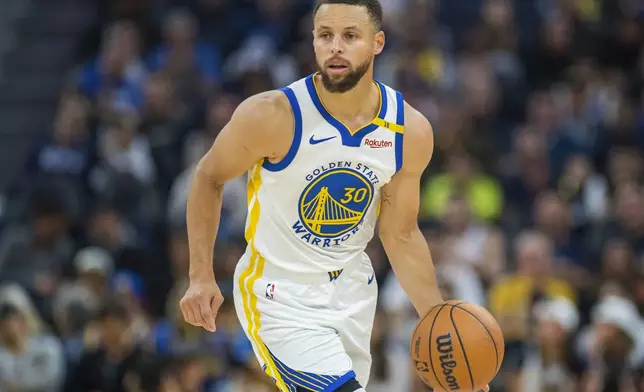 Golden State Warriors guard Stephen Curry (30) dribbles during the first half of an NBA basketball game against the Los Angeles Clippers in San Francisco, Sunday, Oct. 27, 2024. (AP Photo/Nic Coury)