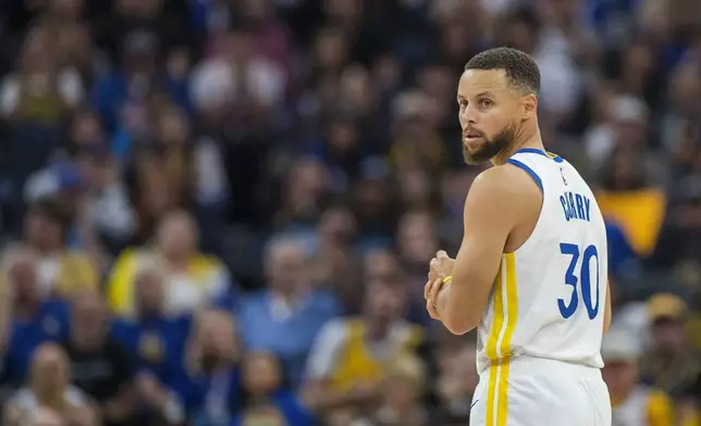 Golden State Warriors guard Stephen Curry (30) looks down the court during the first half of an NBA basketball game against the Los Angeles Clippers in San Francisco, Sunday, Oct. 27, 2024. (AP Photo/Nic Coury)