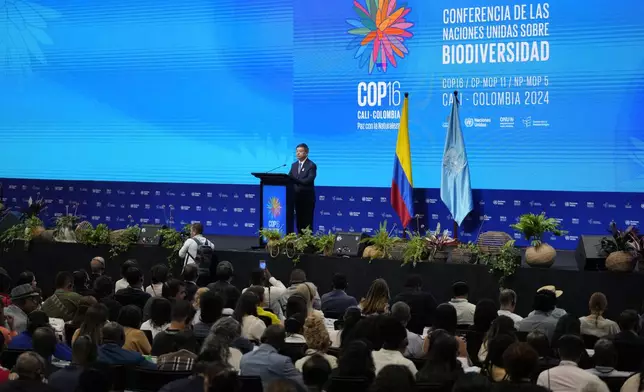 Huang Runqiu, China's minister of ecology and environment, delivers a speech at the opening ceremony of COP16, a United Nations' biodiversity conference, in Cali, Colombia, Sunday, Oct. 20, 2024. (AP Photo/Fernando Vergara)