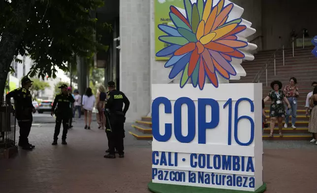 Police stand guard in front of a hotel a day ahead of the COP16 United Nations biodiversity conference, in host city Cali, Colombia, Saturday, Oct. 19, 2024. (AP Photo/Fernando Vergara)