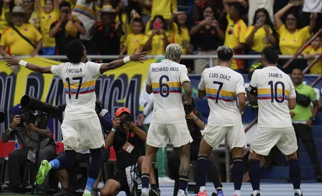 Colombia's Luis Diaz celebrates scoring his side's second goal against Chile during a FIFA World Cup 2026 qualifying soccer match at the Metropolitano Roberto Melendez stadium in Barranquilla, Colombia, Tuesday, Oct. 15, 2024. (AP Photo/Fernando Vergara)