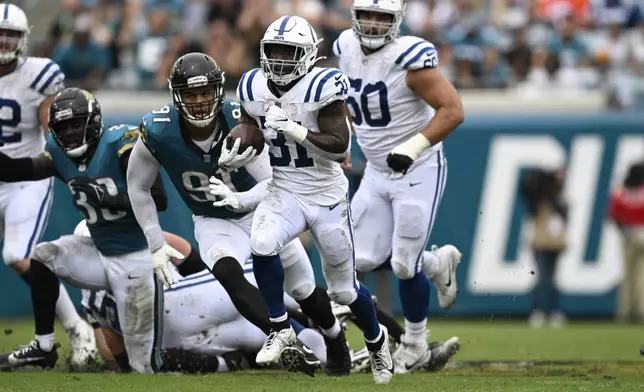 Indianapolis Colts running back Tyler Goodson (31) runs during the first half of an NFL football game against the Jacksonville Jaguars, Sunday, Oct. 6, 2024, in Jacksonville, Fla. (AP Photo/Phelan M. Ebenhack)