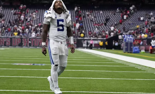 Indianapolis Colts quarterback Anthony Richardson walks off the field after an NFL football game against the Houston Texans, Sunday, Oct. 27, 2024, in Houston. The Texans won 23-20. (AP Photo/Tony Gutierrez)