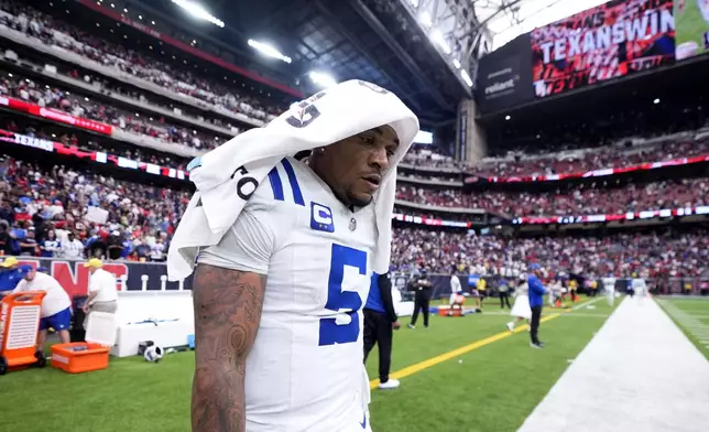 Indianapolis Colts quarterback Anthony Richardson (5) walks off the field after an NFL football game against the Houston Texans, Sunday, Oct. 27, 2024, in Houston. The Texans won 23-20. (AP Photo/Tony Gutierrez)