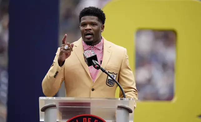 Former Houston Texans Hall of Fame wide receiver Andre Johnson speaks during a ceremony during halftime of an NFL football game between the Texans and the Indianapolis Colts, Sunday, Oct. 27, 2024, in Houston. (AP Photo/Eric Christian Smith)