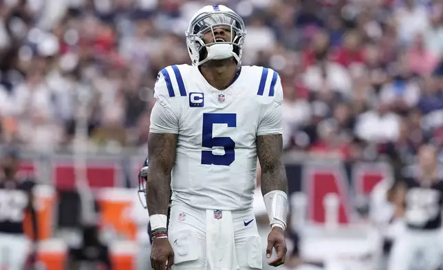 Indianapolis Colts quarterback Anthony Richardson reacts after an incomplete pass during the second half of an NFL football game against the Houston Texans, Sunday, Oct. 27, 2024, in Houston. (AP Photo/Tony Gutierrez)