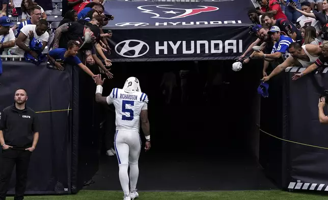 Indianapolis Colts quarterback Anthony Richardson walks off the field after an NFL football game against the Houston Texans, Sunday, Oct. 27, 2024, in Houston. The Texans won 23-20. (AP Photo/Tony Gutierrez)