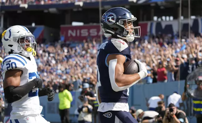 Tennessee Titans wide receiver Nick Westbrook-Ikhine (15) celebrates a touchdown during the first half of an NFL football game against the Indianapolis Colts, Sunday, Oct. 13, 2024, in Nashville, Tenn. (AP Photo/George Walker IV)