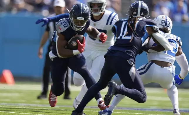 Tennessee Titans running back Tony Pollard (20) runs during the first half of an NFL football game against the Indianapolis Colts, Sunday, Oct. 13, 2024, in Nashville, Tenn. (AP Photo/George Walker IV)