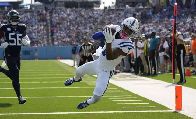 Indianapolis Colts wide receiver Josh Downs (1) makes a touchdown catch during the first half of an NFL football game against the Tennessee Titans, Sunday, Oct. 13, 2024, in Nashville, Tenn. (AP Photo/George Walker IV)