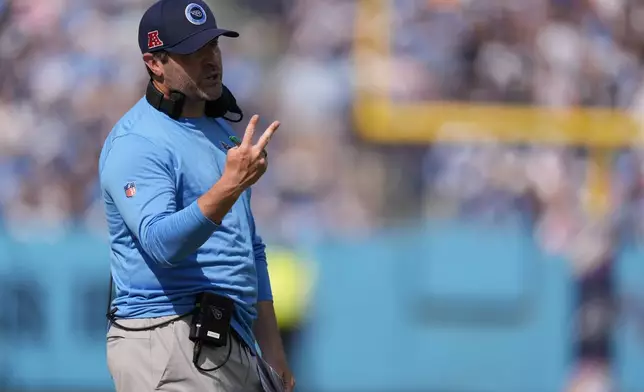 Tennessee Titans head coach Brian Callahan calls a play during the first half of an NFL football game against the Indianapolis Colts, Sunday, Oct. 13, 2024, in Nashville, Tenn. (AP Photo/George Walker IV)