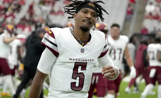 Washington Commanders quarterback Jayden Daniels (5) takes the field prior to an NFL football game against the Arizona Cardinals, Sunday, Sept. 29, 2024, in Glendale, Ariz. (AP Photo/Rick Scuteri)