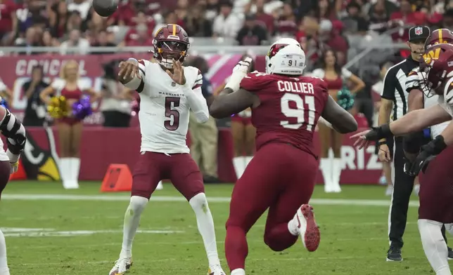 Washington Commanders quarterback Jayden Daniels (5) throws under pressure from Arizona Cardinals defensive end L.J. Collier (91) during the second half of an NFL football game, Sunday, Sept. 29, 2024, in Glendale, Ariz. (AP Photo/Rick Scuteri)