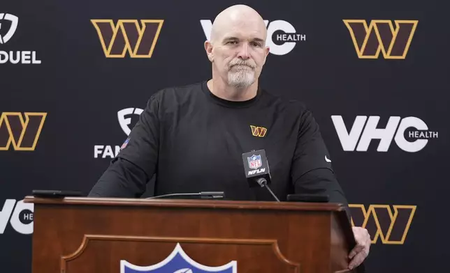 Washington Commanders head coach Dan Quinn pauses during a news conference following an NFL football game against the Baltimore Ravens Sunday, Oct. 13, 2024, in Baltimore. (AP Photo/Stephanie Scarbrough)