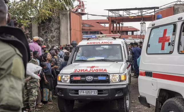 An ambulance carries victims away from the port of Goma, Democratic Republic of Congo, after a ferry carrying hundreds capsized on arrival Thursday, Oct. 3, 2024. (AP Photo/Moses Sawasawa)