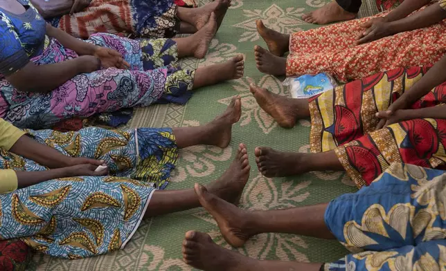 Nelly Shukuru, 51, and others receive counseling in Goma, Democratic Republic of the Congo, Tuesday, Aug. 27, 2024. (AP Photo/Moses Sawasawa)