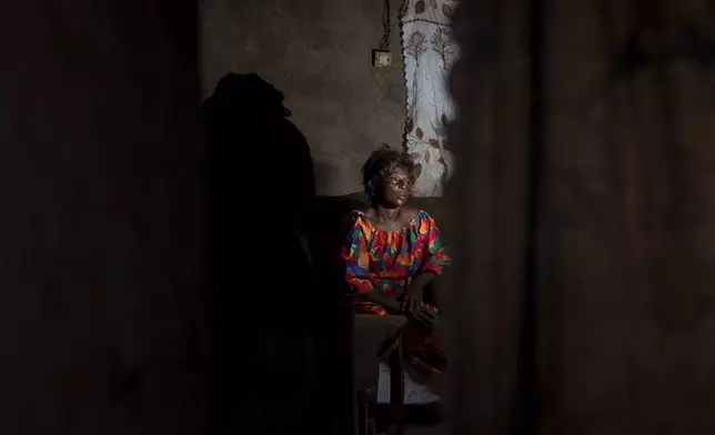 Sifa Kunguja, a 40-year-old sex worker, sits home after recovering from mpox Wednesday, Sept. 4, 2024 in Kamituga, eastern Congo. (AP Photo/Moses Sawasawa)