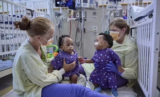 This undated photo provided by the Children’s Hospital of Philadelphia in October 2024 shows previously conjoined twins, Amari and Javar Ruffin, after separation surgery at the Children’s Hospital of Philadelphia. (Ed Cunicelli/Children’s Hospital of Philadelphia via AP)