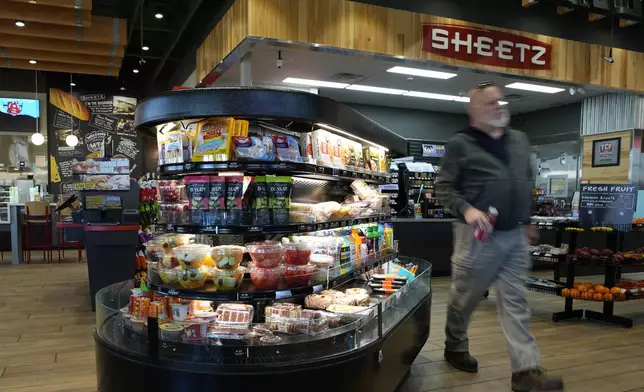 A customer walks through a Sheetz convenience store, Thursday, Oct. 17, 2024, in Bethlehem, Pa. (AP Photo/Matt Slocum)